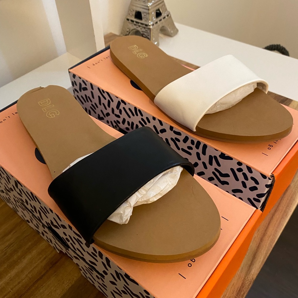 2 pairs of flats…white an black